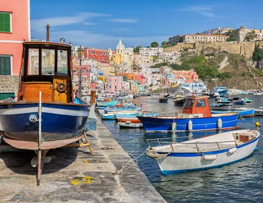 Pier on the Amalfi Coast, boast littering the water's edge.