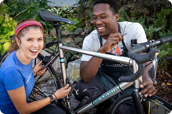 Backroads leaders doing bike maintenance
