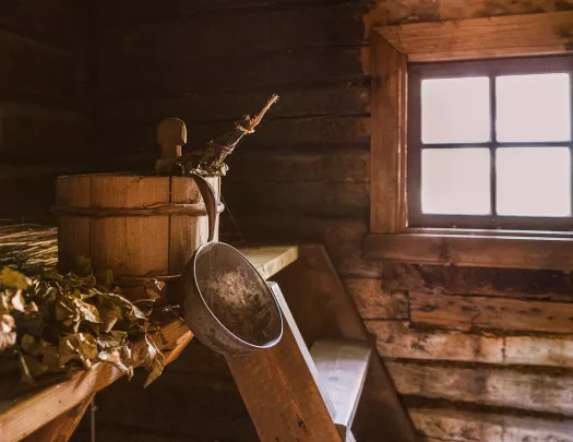Wooden bucket in a wood cabin