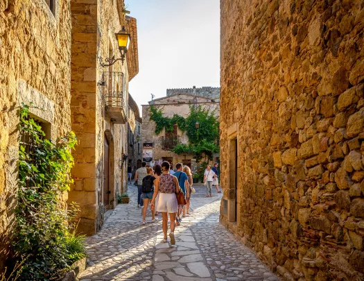 Walking down a cobblestone street in Europe